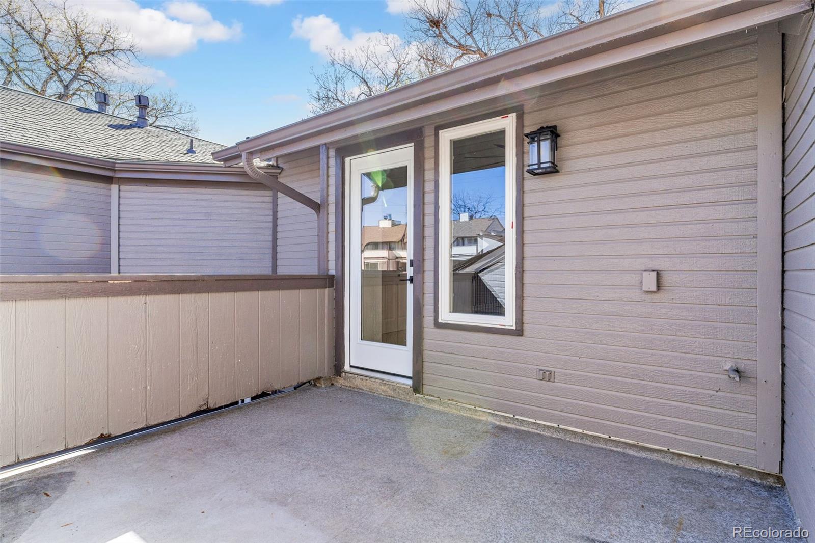 5051 Garrison Street, Unit 7C Wheat Ridge, CO 80033 - Photo 22 of 27 a view of a house with a door