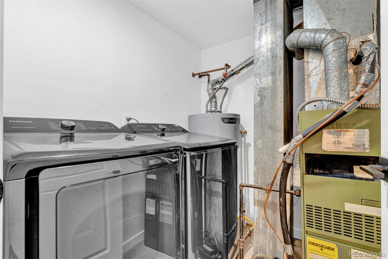 5051 Garrison Street, Unit 7C Wheat Ridge, CO 80033 - Photo 23 of 27 a utility room with dryer and washer
