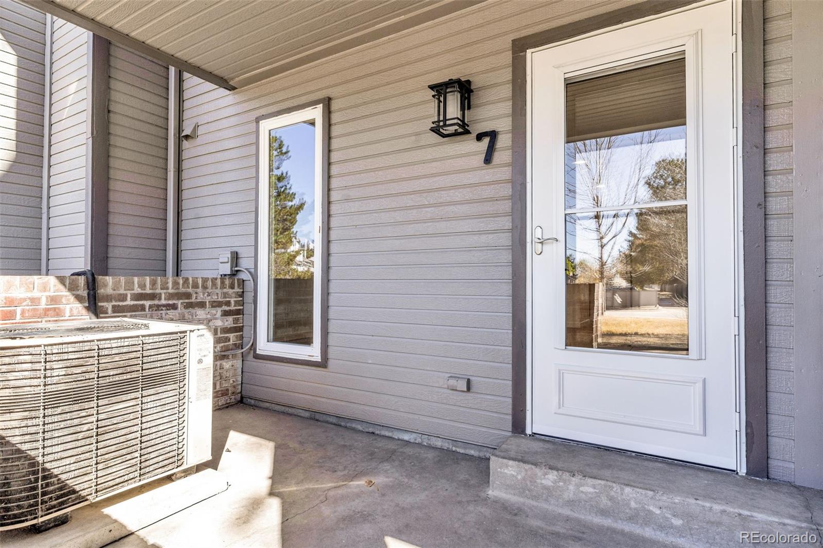 5051 Garrison Street, Unit 7C Wheat Ridge, CO 80033 - Photo 25 of 27 a view of a door and a window