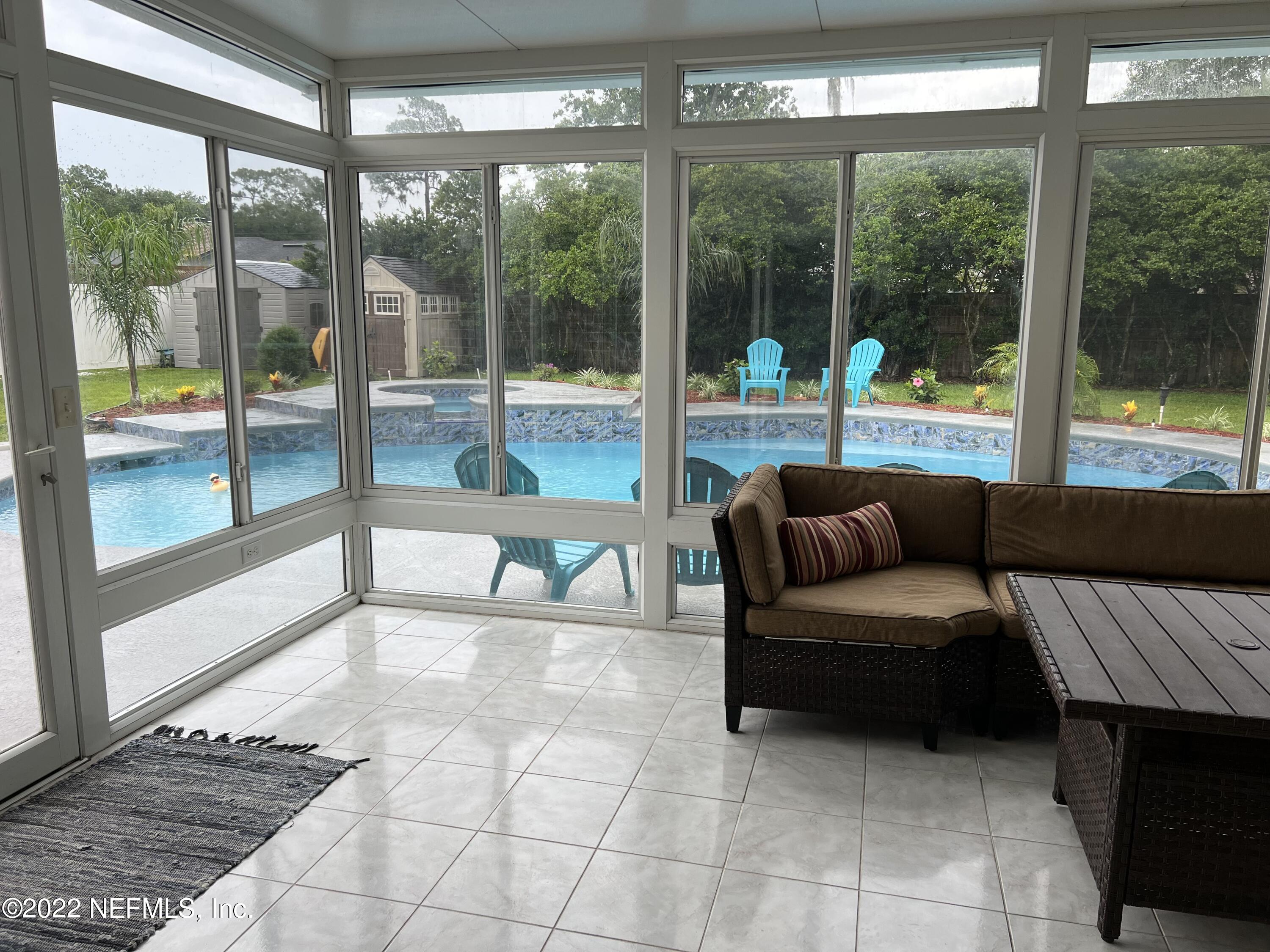 1043 Martinique Road Jacksonville, FL 32216 - Photo 2 of 24 glassed in Florida room