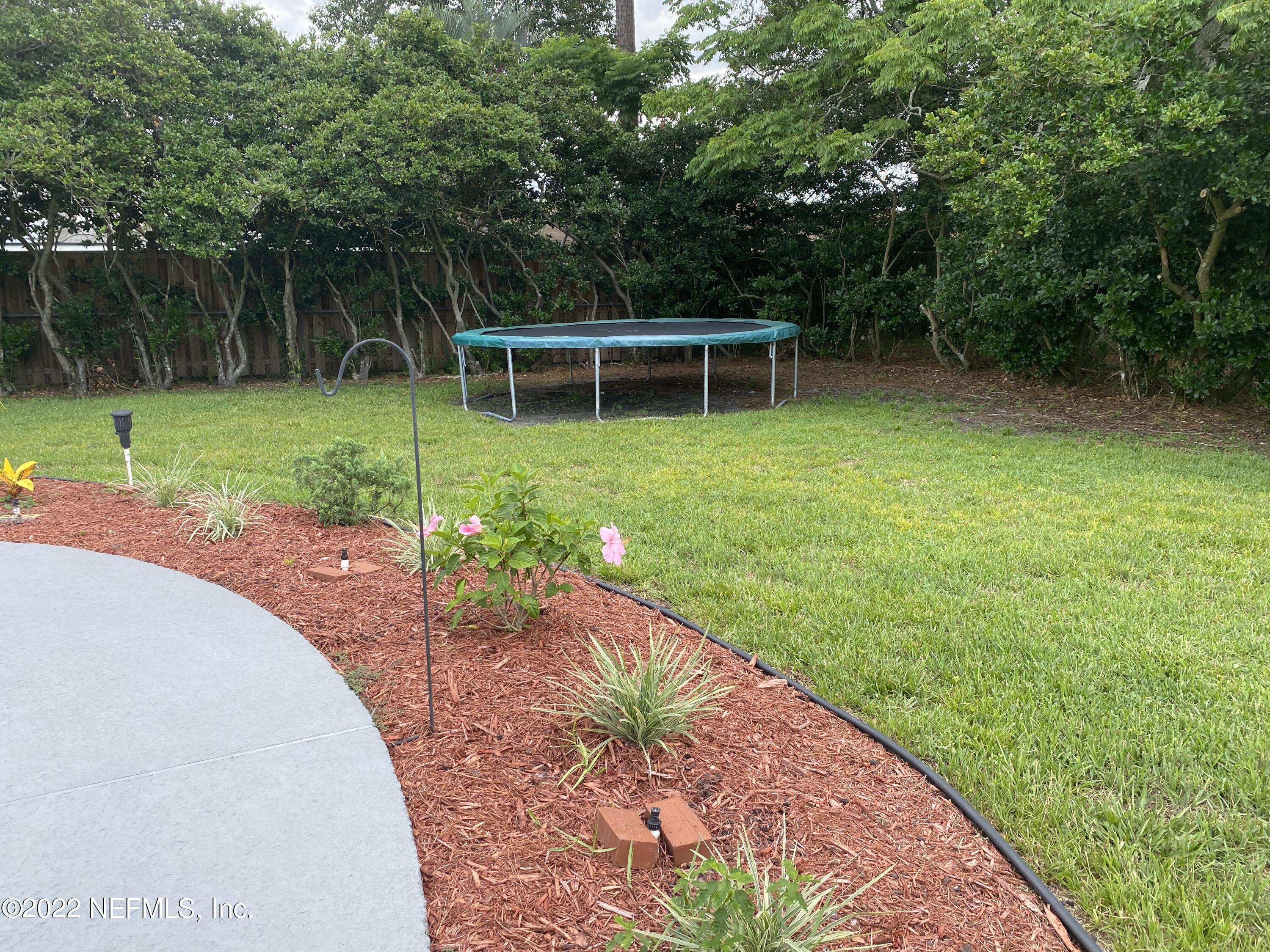 1043 Martinique Road Jacksonville, FL 32216 - Photo 23 of 24 landscaped rear (trampoline negot)