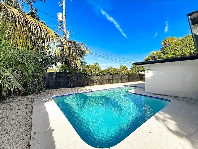 an aerial view of multiple houses with yard