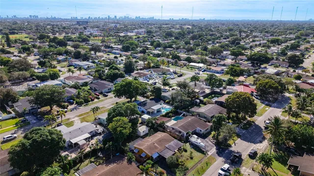 a view of a room with furniture and a potted plant