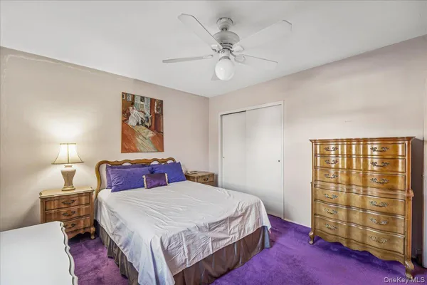 a bedroom with a bed and a table in it