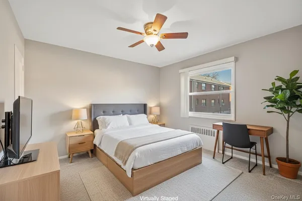 a bedroom with a bed and a dresser in it