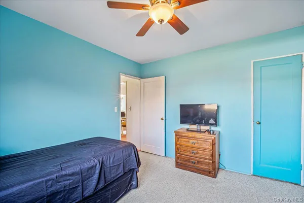 a bathroom with a sink mirror vanity and toilet