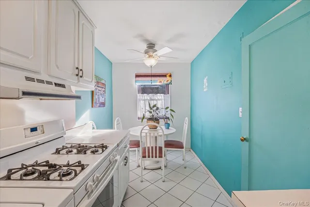 a kitchen with a stove and a refrigerator