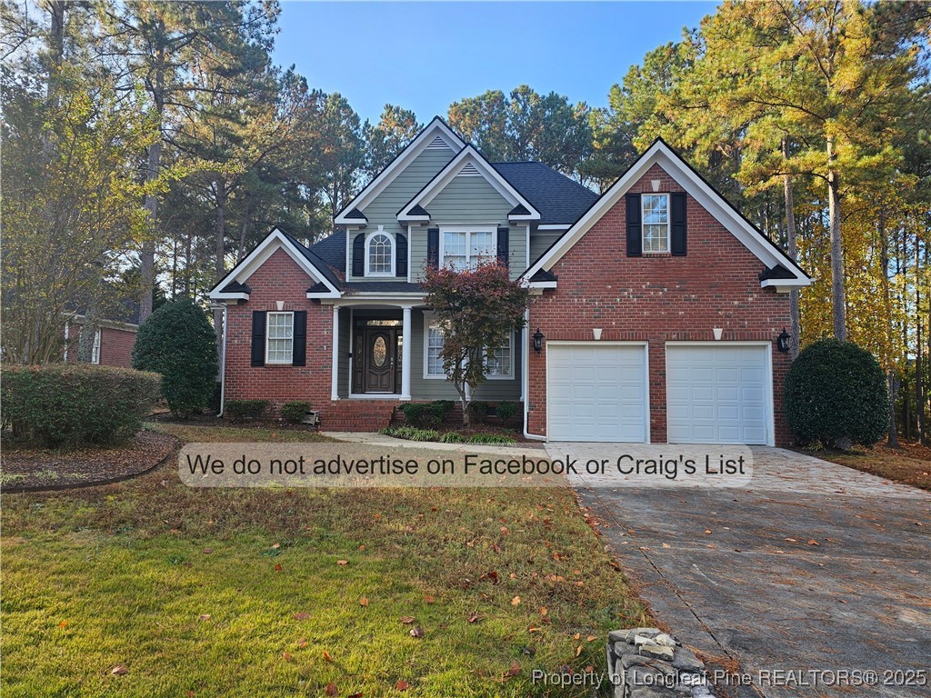 50 Barons Run East Spring Lake, NC 28390 - Photo 1 of 28 a front view of a house with a yard