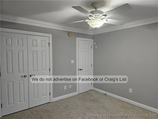 a bathroom with a toilet and a mirror