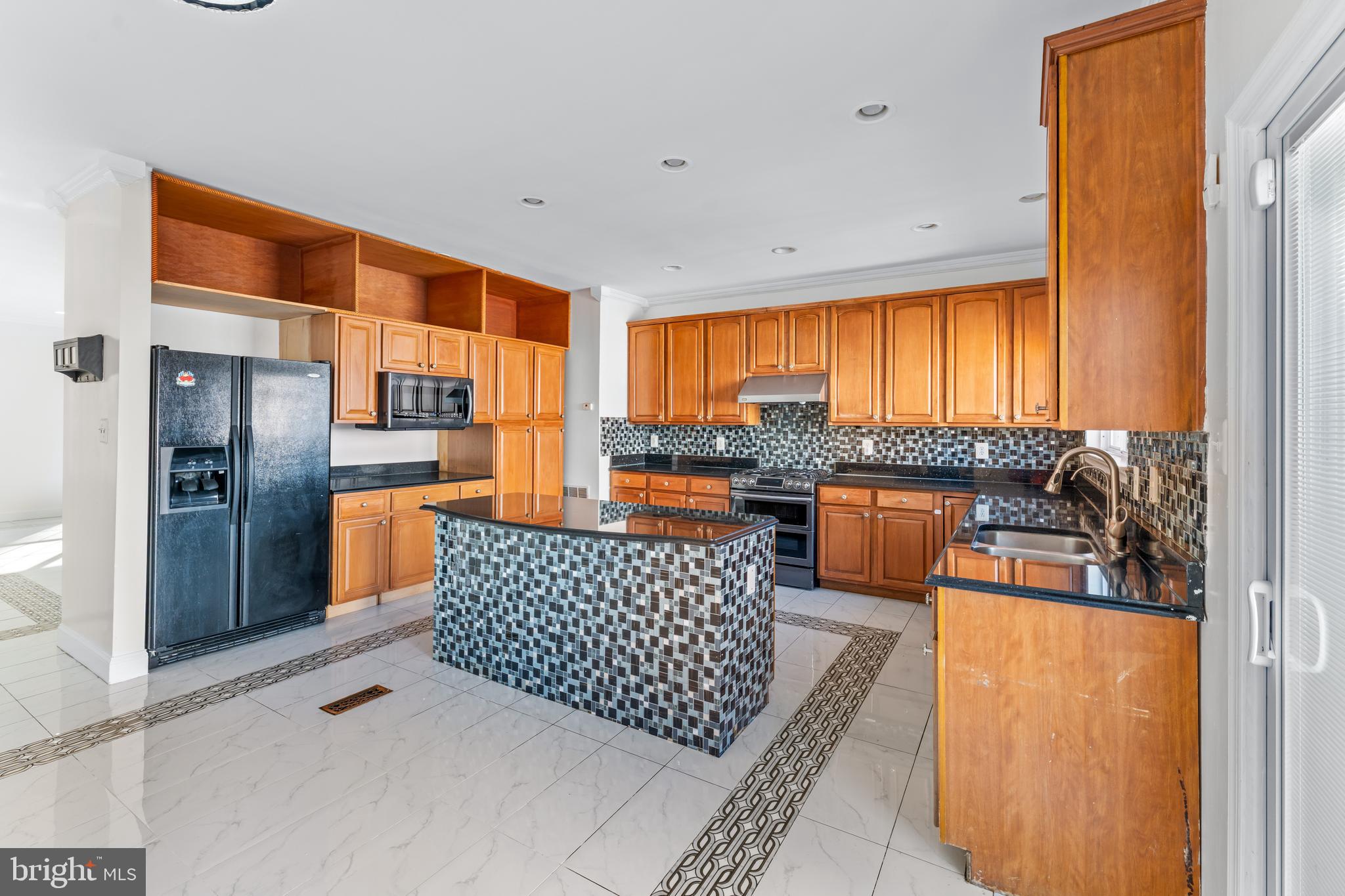 7510 Gilley Terrace Rosedale, MD 21237 - Photo 15 of 46 a kitchen with stainless steel appliances granite countertop a refrigerator and a stove