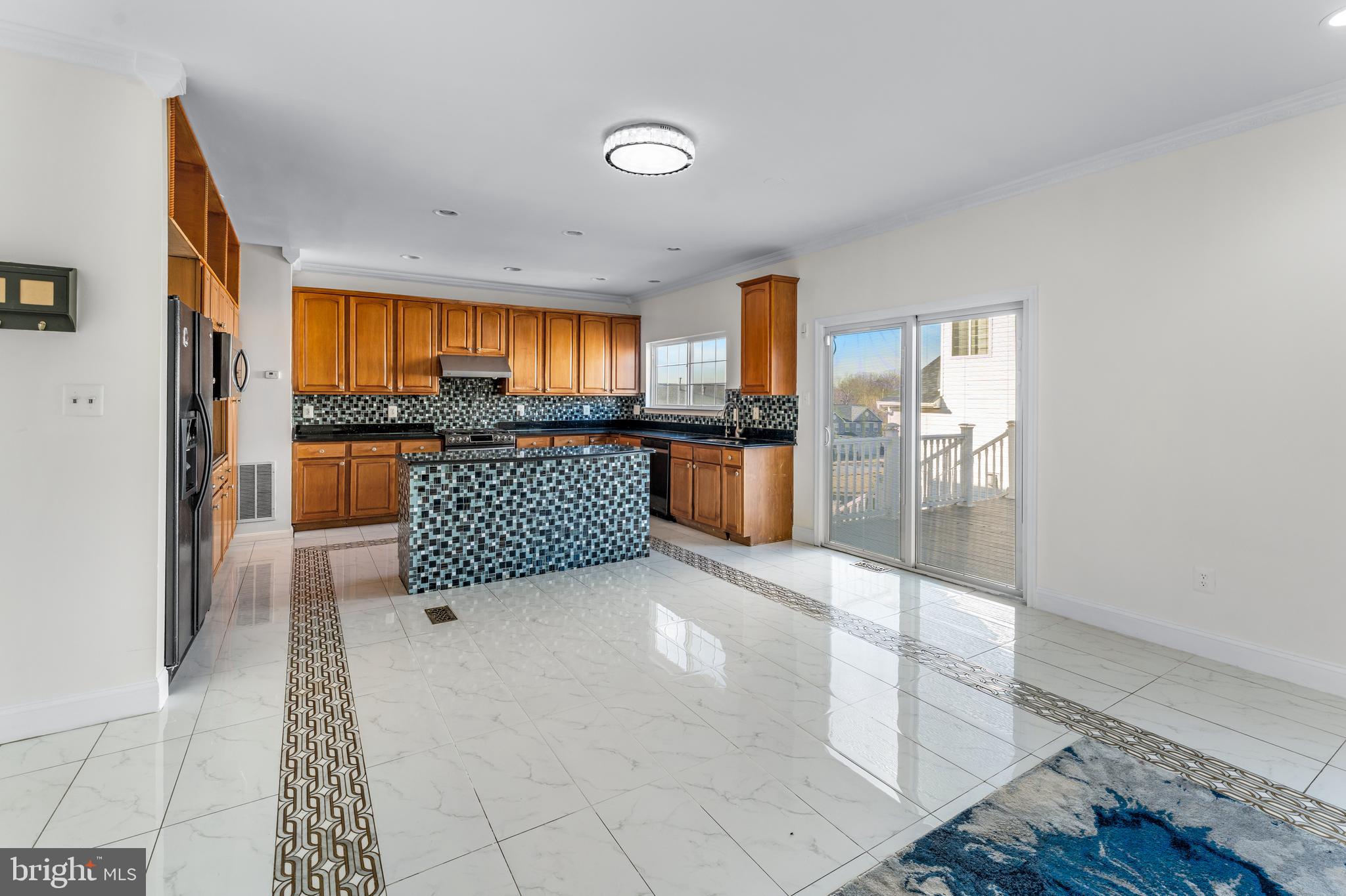 7510 Gilley Terrace Rosedale, MD 21237 - Photo 23 of 46 a living room with stainless steel appliances furniture a rug and a view of kitchen