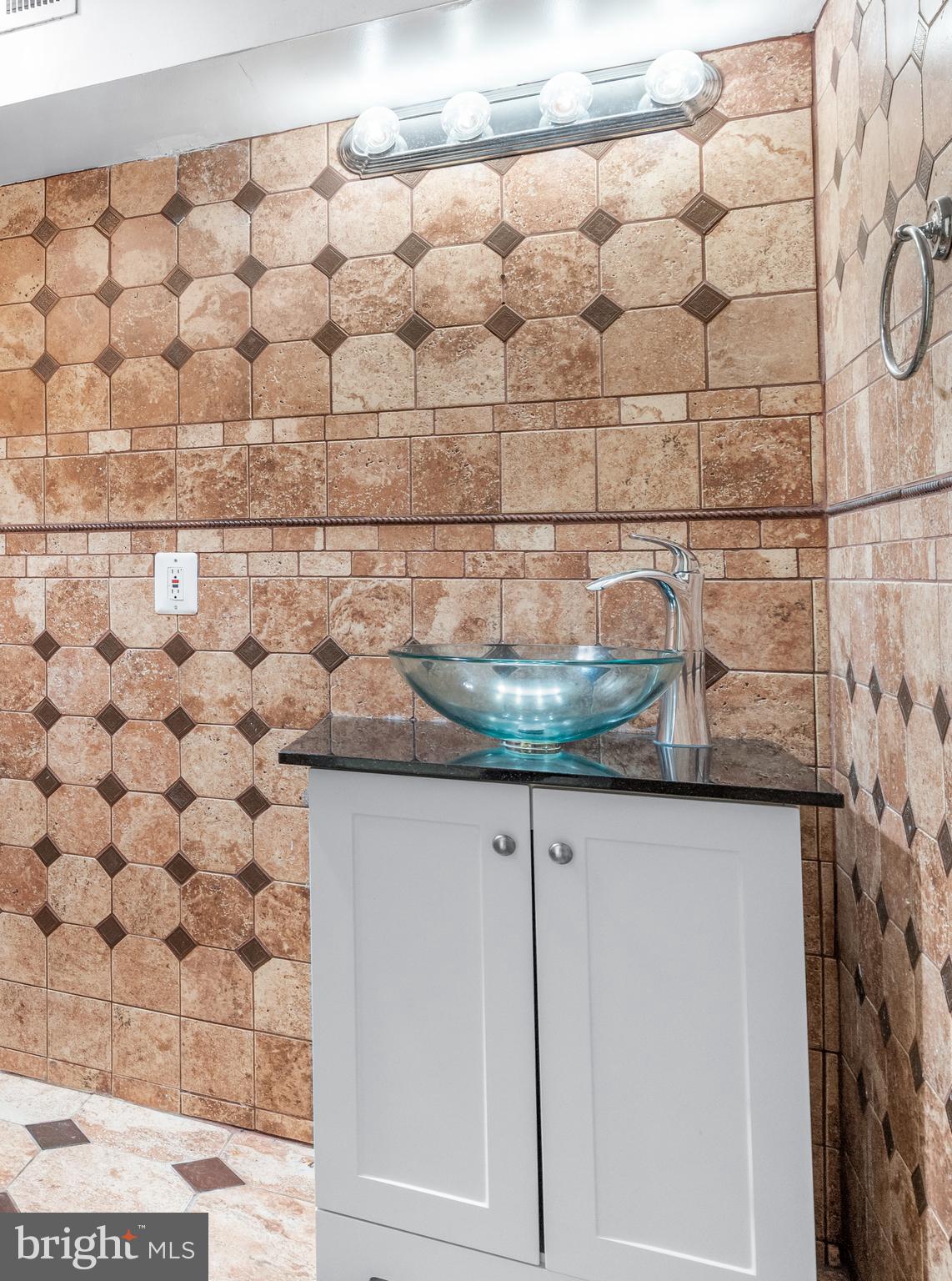 7510 Gilley Terrace Rosedale, MD 21237 - Photo 42 of 46 a bathroom with a granite countertop sink and a mirror