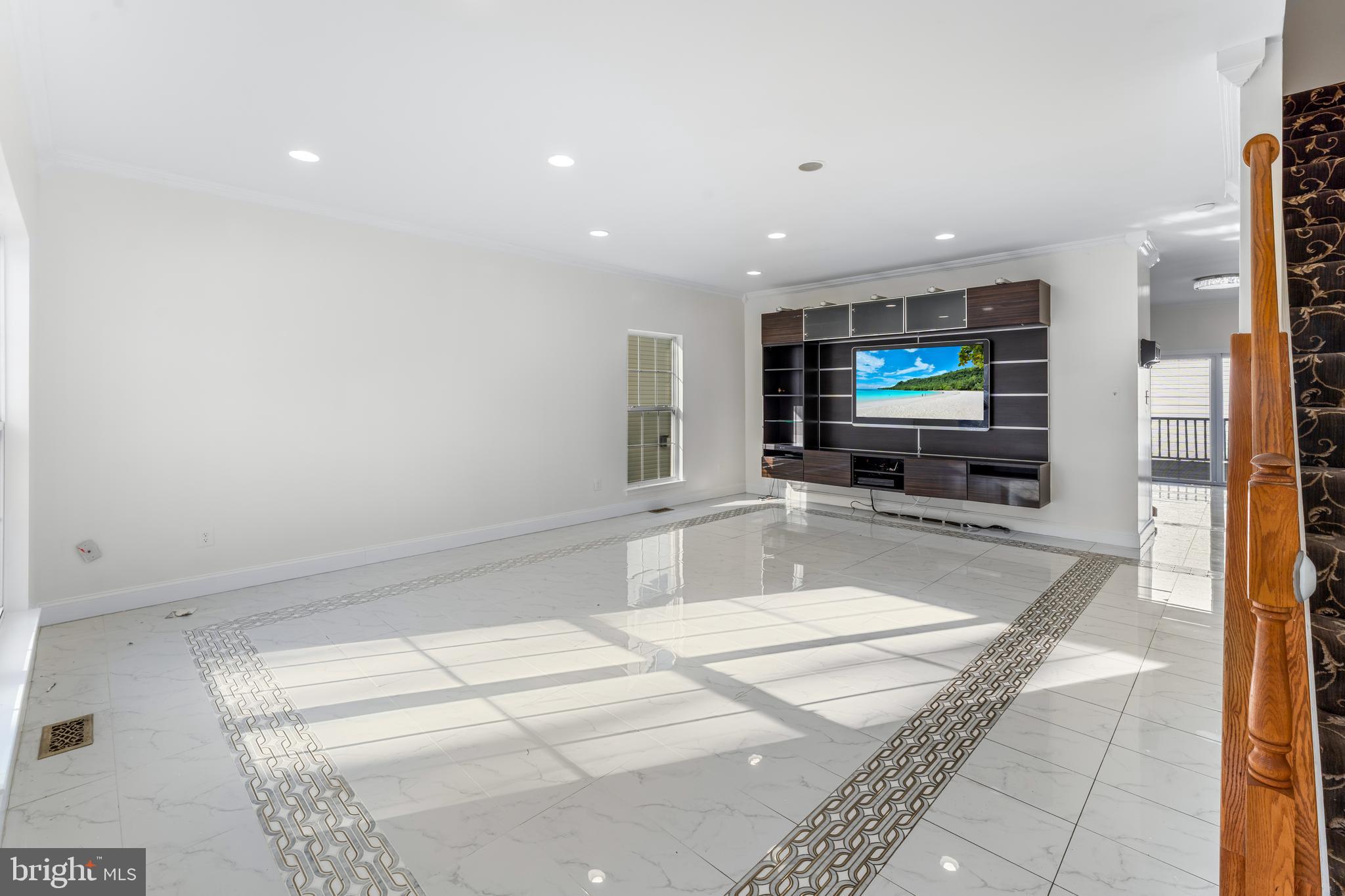 7510 Gilley Terrace Rosedale, MD 21237 - Photo 9 of 46 a lobby with a flat screen tv and a rug