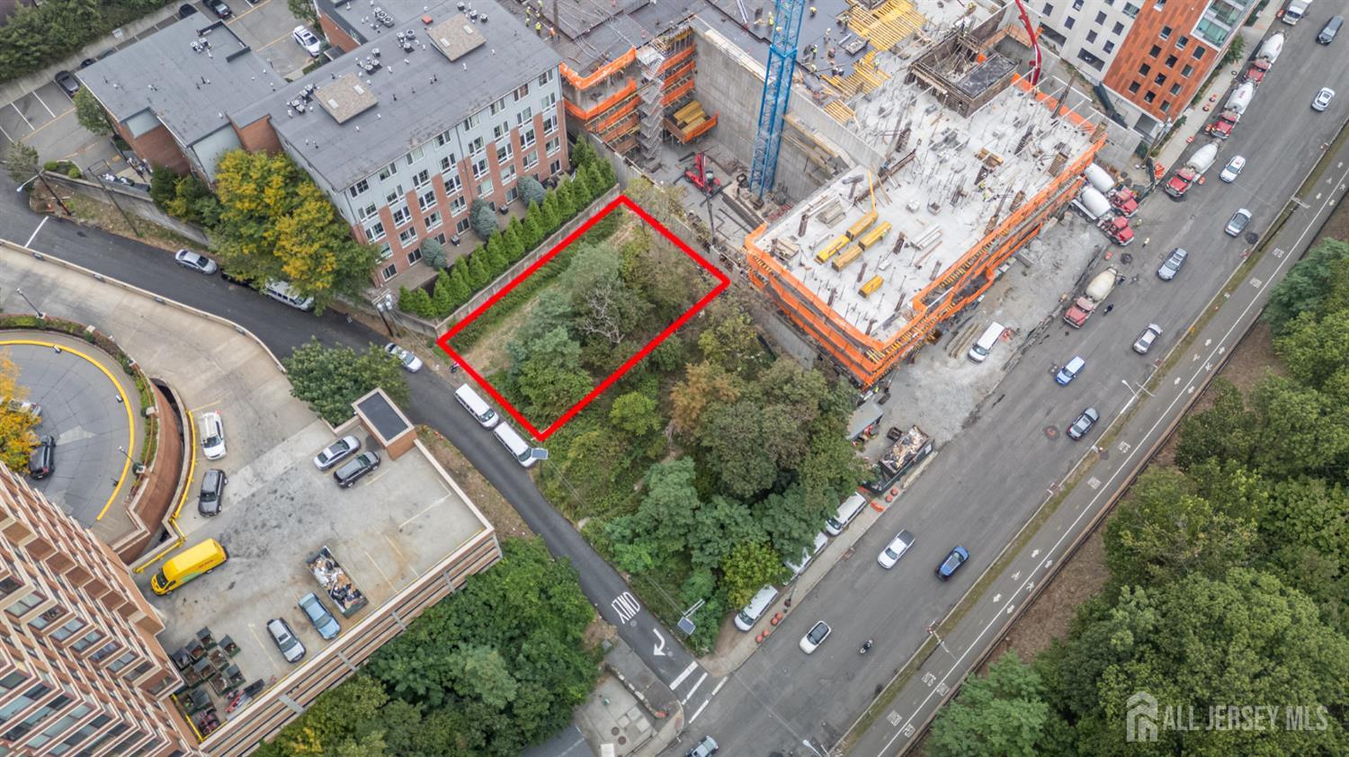 107 Old Palisade Road Fort Lee, NJ 07024 - Photo 2 of 11 an aerial view of a house with a yard and lake view