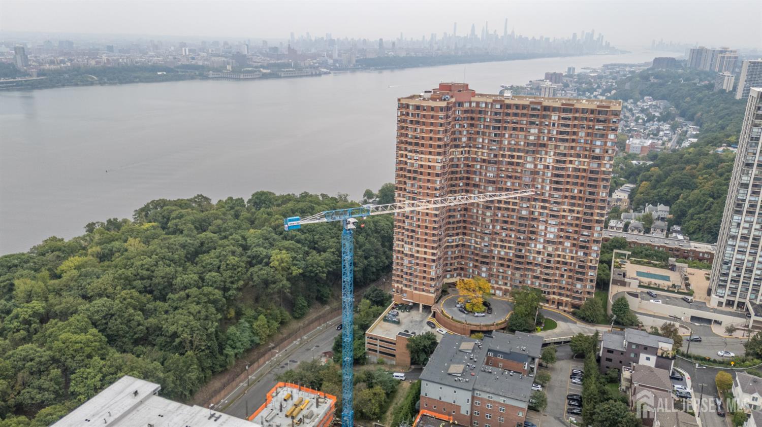 107 Old Palisade Road Fort Lee, NJ 07024 - Photo 5 of 11 a city view with tall buildings and a bench