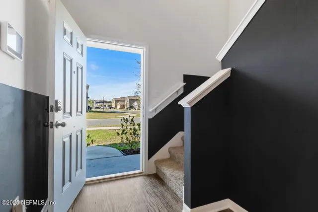 a bedroom with a bed and a ceiling fan