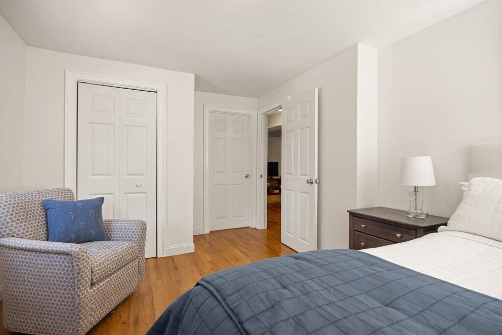 280 E Street, Unit 1 Boston, MA 02127 - Photo 11 of 19 a bedroom with a bed and a couch