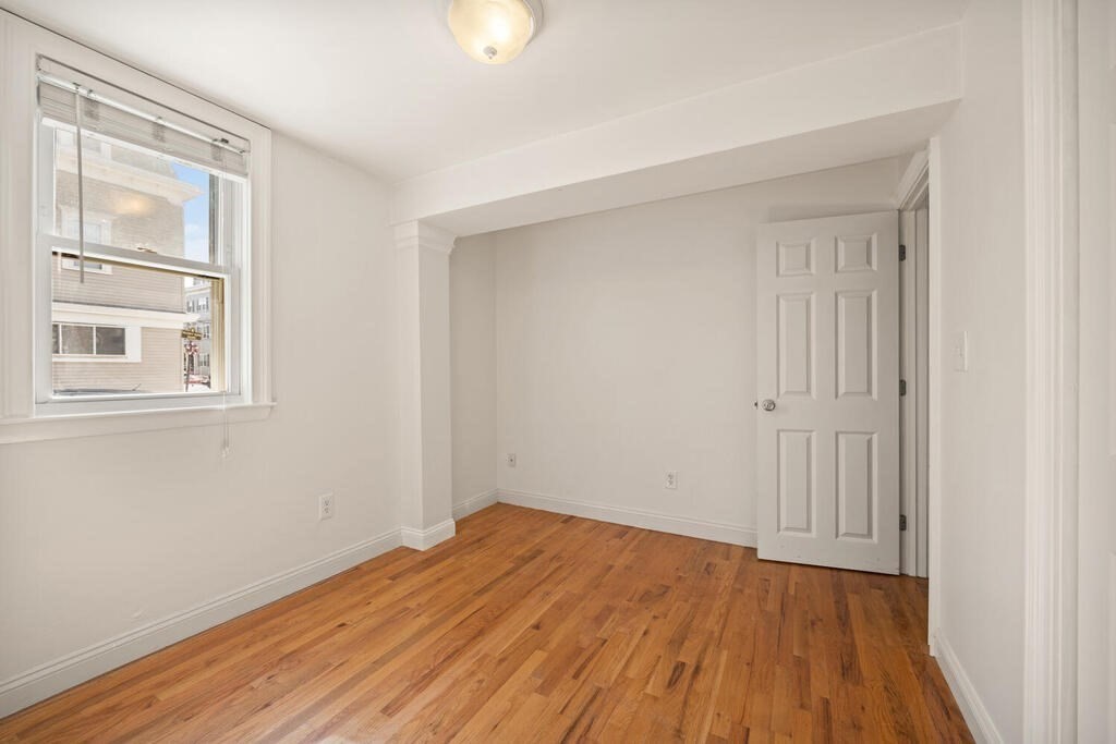 280 E Street, Unit 1 Boston, MA 02127 - Photo 13 of 19 a view of empty room with wooden floor and fan
