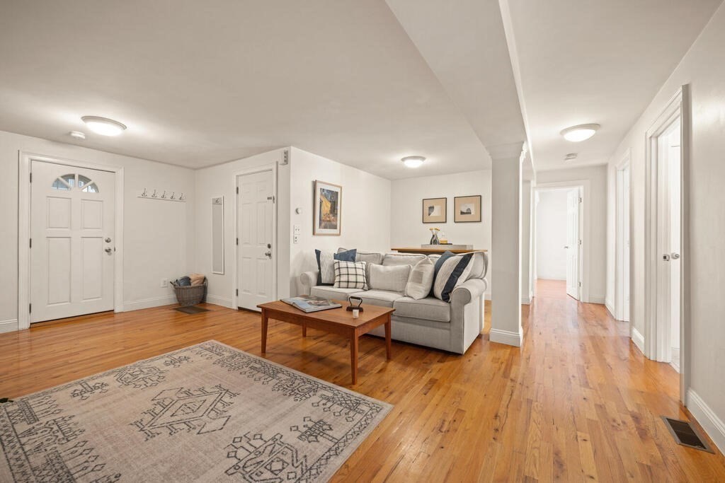280 E Street, Unit 1 Boston, MA 02127 - Photo 2 of 19 a living room with furniture and a rug