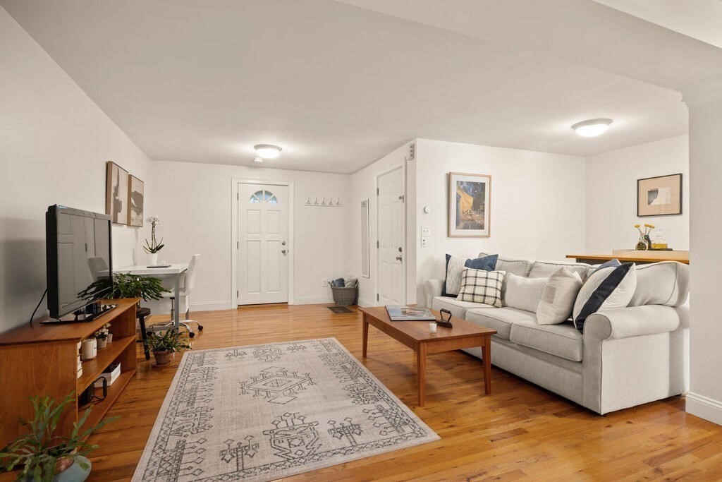 280 E Street, Unit 1 Boston, MA 02127 - Photo 3 of 19 a living room with furniture and a flat screen tv