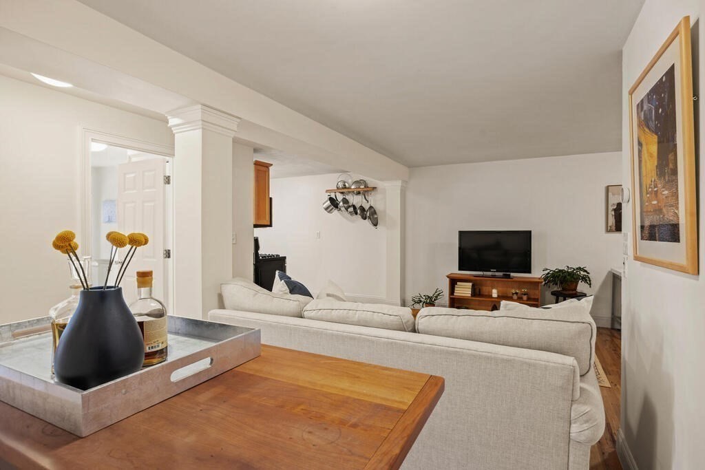 280 E Street, Unit 1 Boston, MA 02127 - Photo 4 of 19 a living room with furniture and a flat screen tv