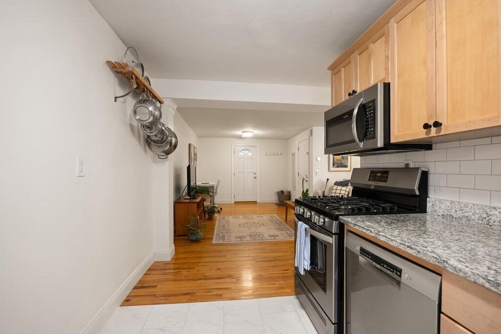 280 E Street, Unit 1 Boston, MA 02127 - Photo 8 of 19 a kitchen with a stove and a microwave