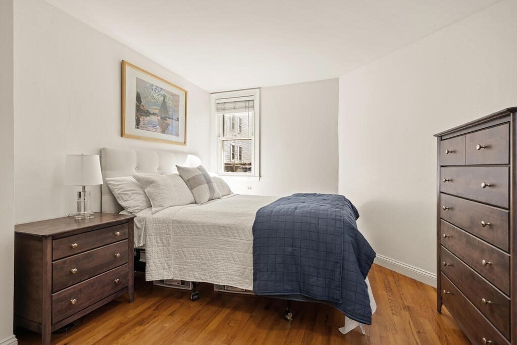 280 E Street, Unit 1 Boston, MA 02127 - Photo 10 of 19 a bedroom with a bed and a dresser