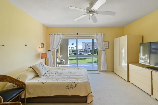 a bed sitting in a room next to a window