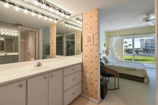 a room with view of closet and mirror