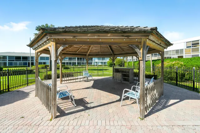 a view of a swimming pool with a yard