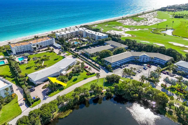 an aerial view of a residential houses with outdoor space and street view