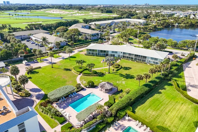 an aerial view of a house with a swimming pool yard and outdoor seating