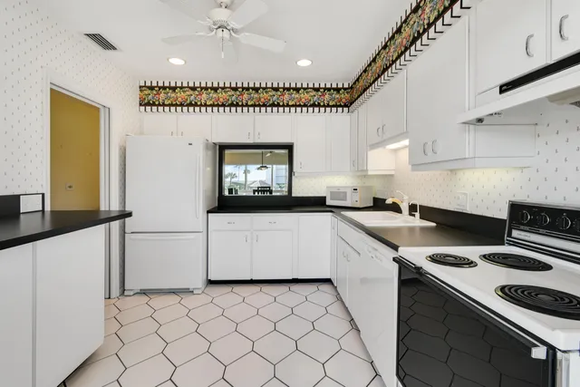 a kitchen with a stove and a sink