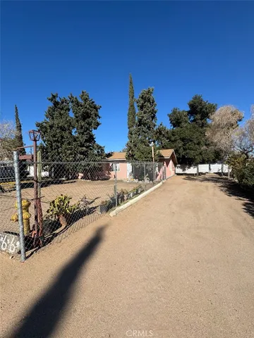 a view of a road with a building in the background