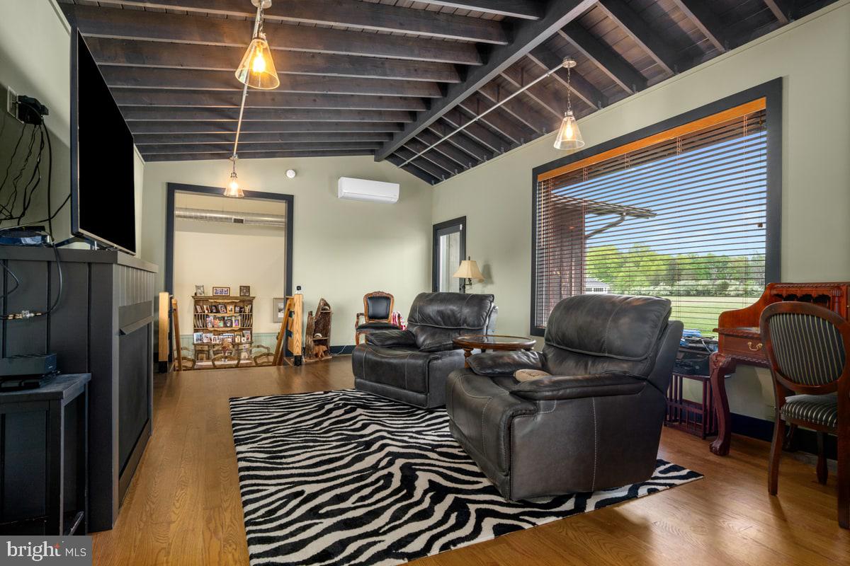 13 Rope Walk Road Upper Black Eddy, PA 18972 - Photo 5 of 40 a living room with furniture ceiling fan and a window