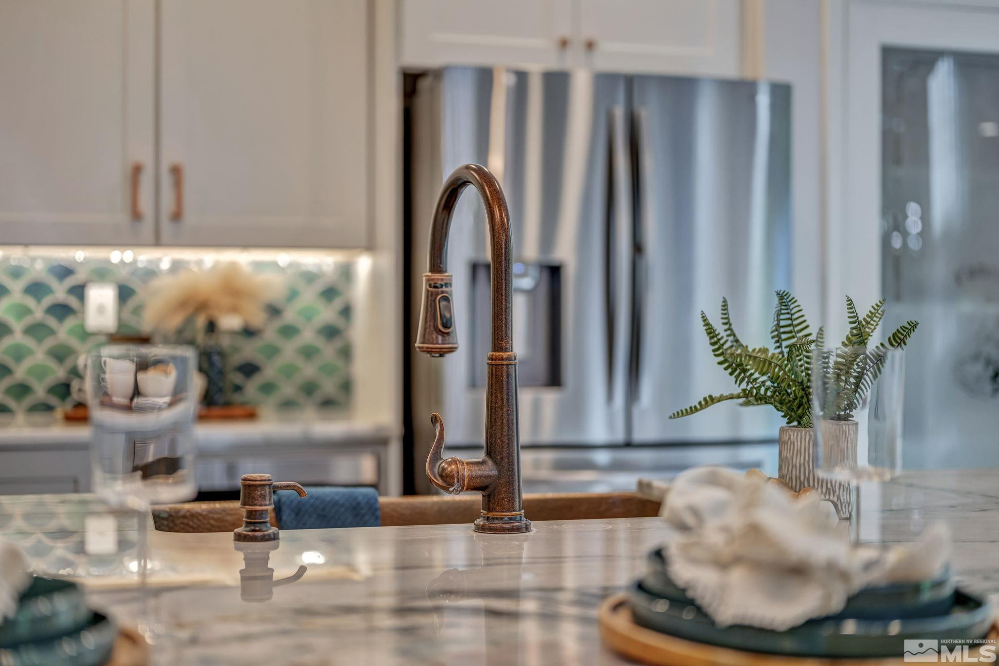 11355 Crotone Way Reno, NV 89521 - Photo 15 of 39 a view of a living room with a floor to ceiling window and potted plant