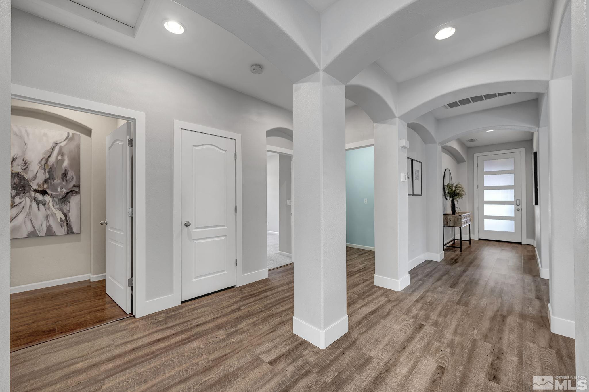 11355 Crotone Way Reno, NV 89521 - Photo 20 of 39 a view of a hallway with wooden floor