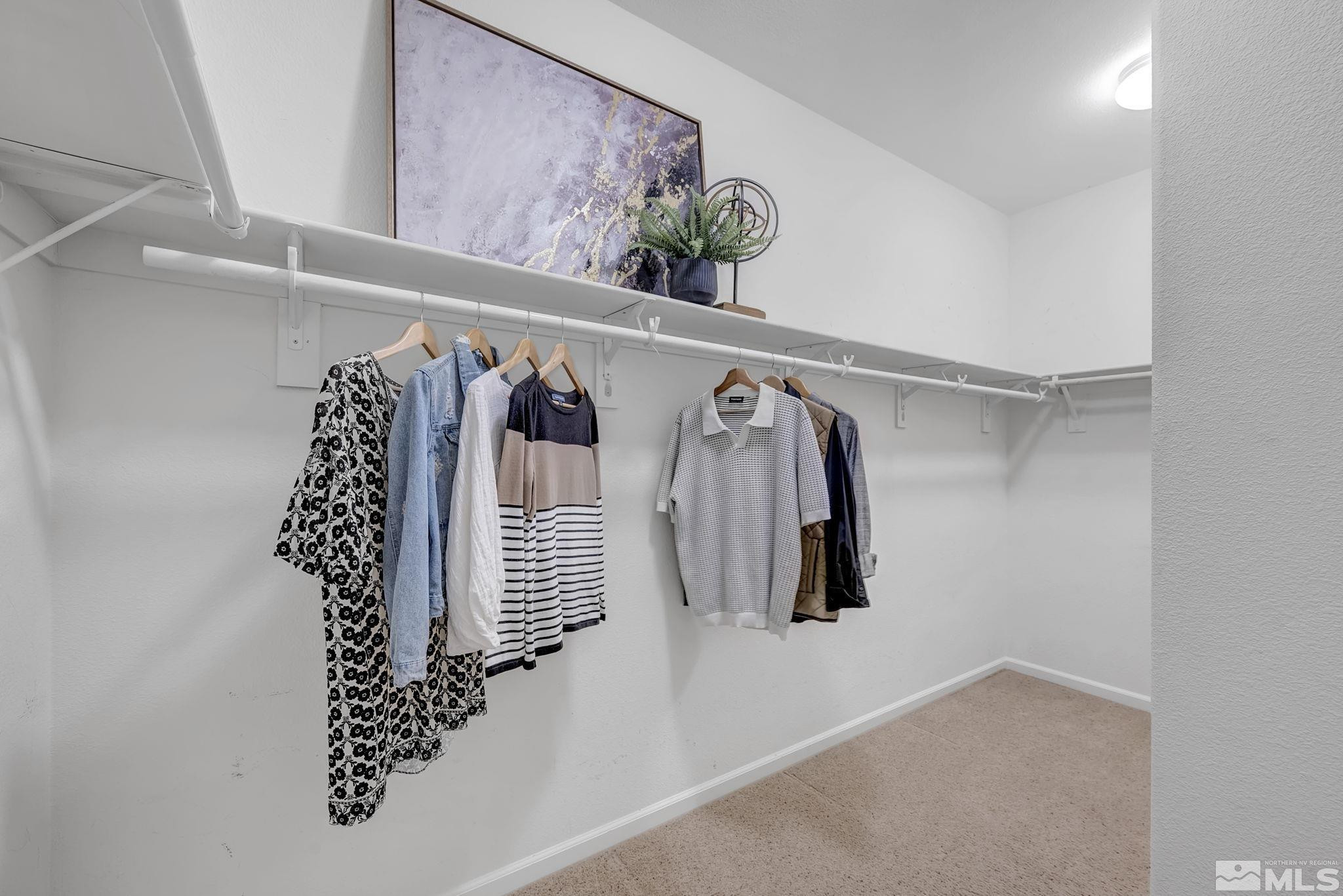 11355 Crotone Way Reno, NV 89521 - Photo 28 of 39 a view of walk in closet with clothes and shoes