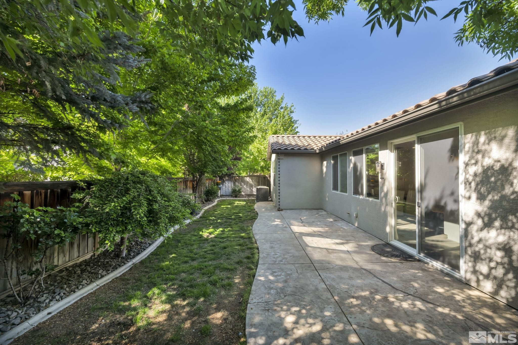 11355 Crotone Way Reno, NV 89521 - Photo 35 of 39 a view of a house with backyard and sitting area