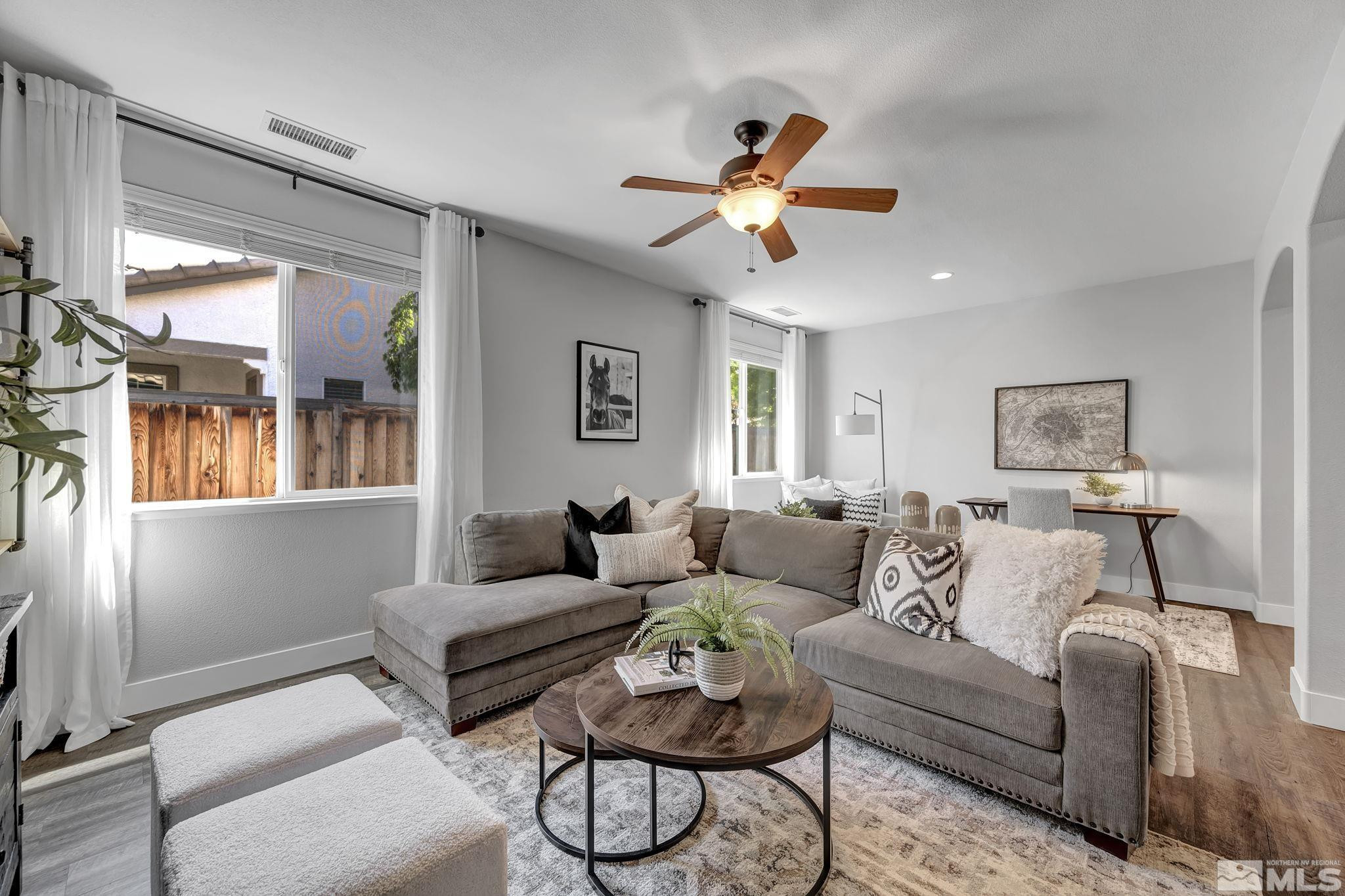 11355 Crotone Way Reno, NV 89521 - Photo 5 of 39 a living room with furniture and a large window