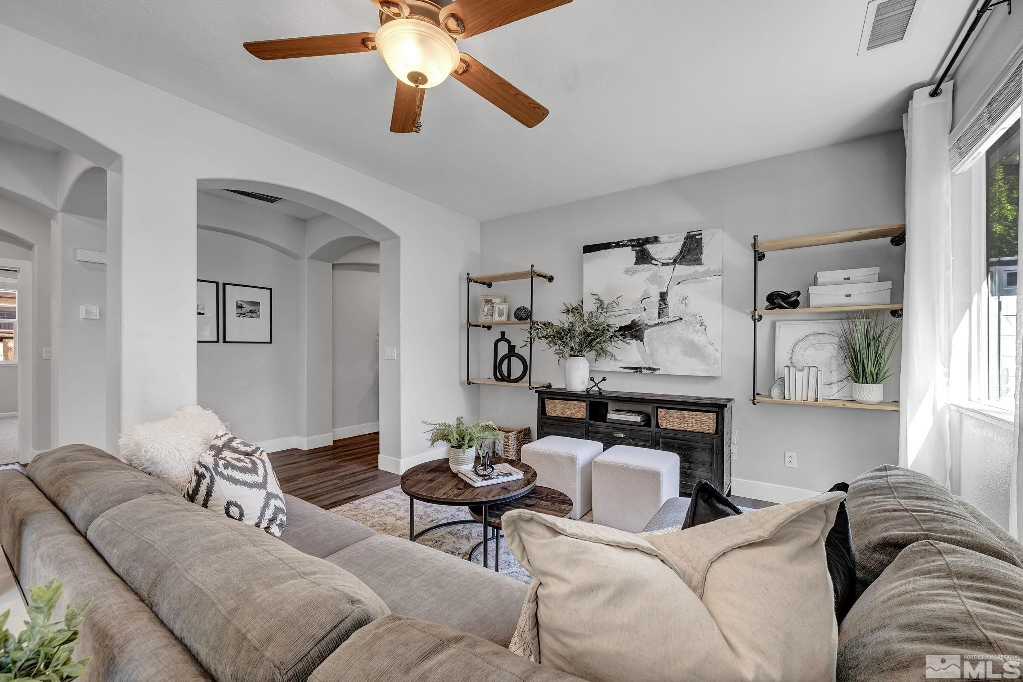 11355 Crotone Way Reno, NV 89521 - Photo 7 of 39 a living room with furniture and painting on the wall