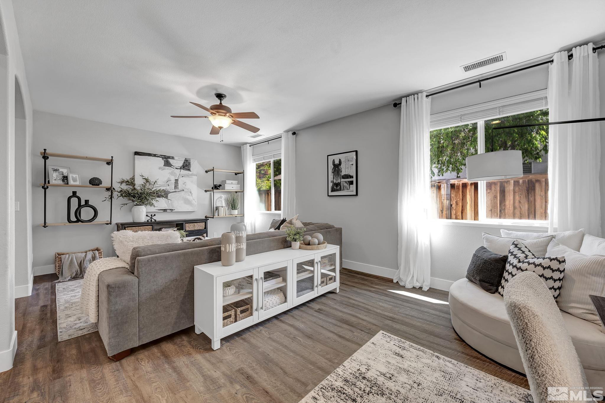 11355 Crotone Way Reno, NV 89521 - Photo 9 of 39 a living room with stainless steel appliances furniture and a window