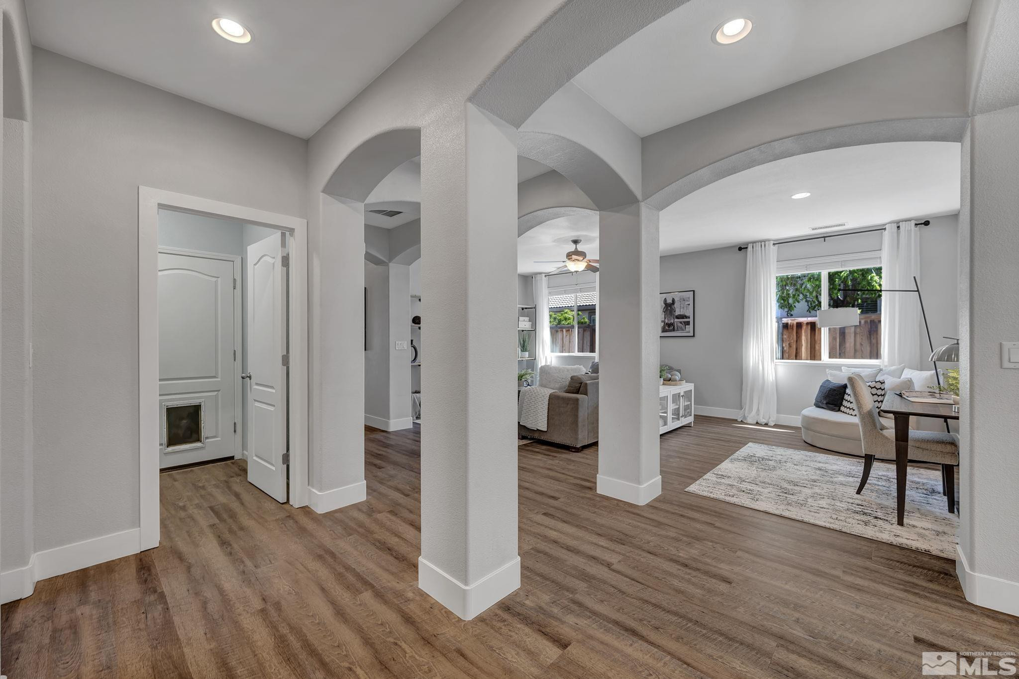 11355 Crotone Way Reno, NV 89521 - Photo 10 of 39 a living room with furniture and a wooden floor