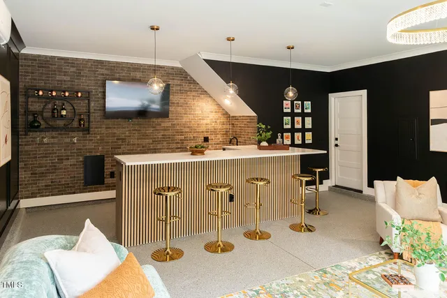 a kitchen with a sink refrigerator and cabinets