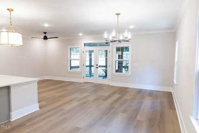 a view of a closet area with wooden floor