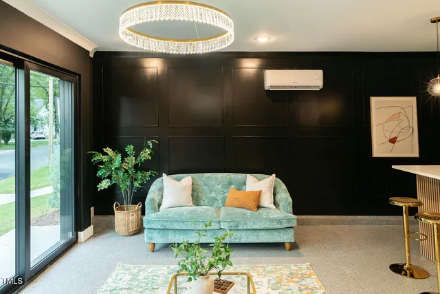 a living room with furniture flowerpot and a potted plant