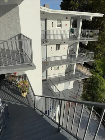 a view of balcony with furniture