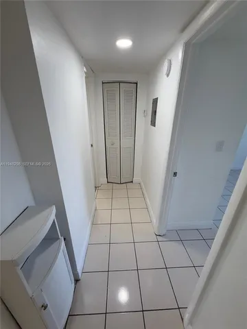 a bathroom with a shower and a sink