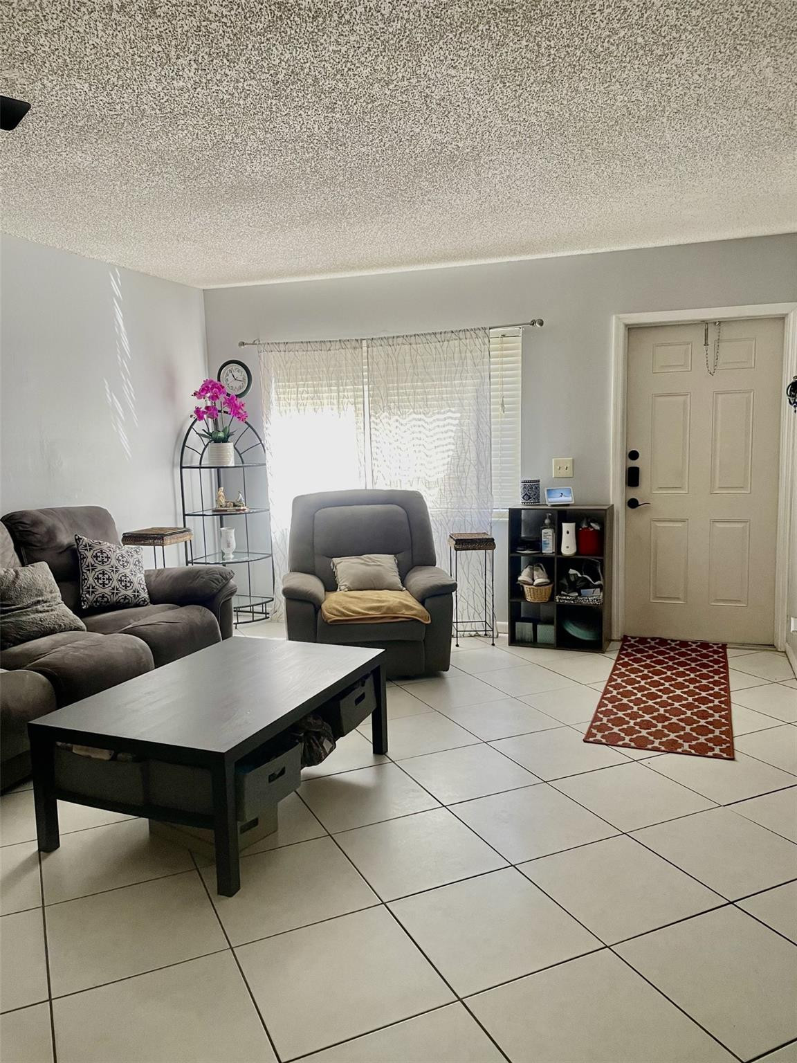 9787 Riverside Drive, Unit 624 Coral Springs, FL 33071 - Photo 11 of 21 a living room with furniture and a window
