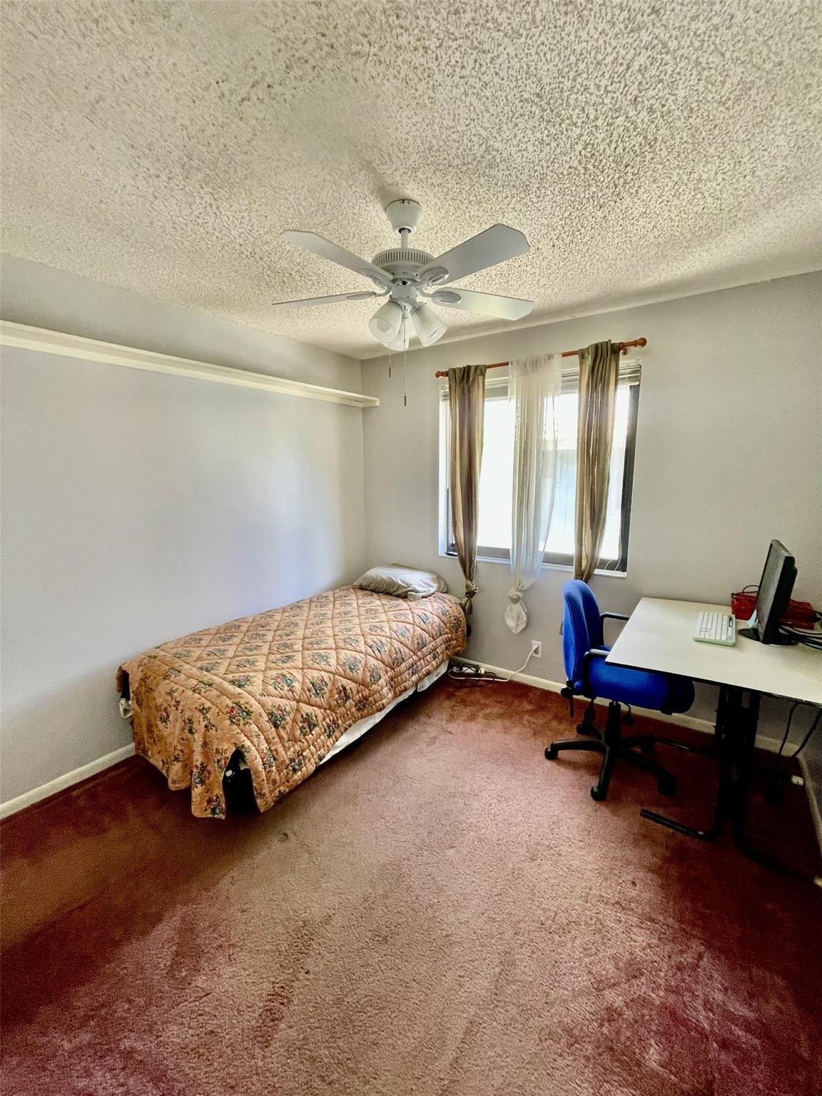 9787 Riverside Drive, Unit 624 Coral Springs, FL 33071 - Photo 14 of 21 a bedroom with a bed and large windows